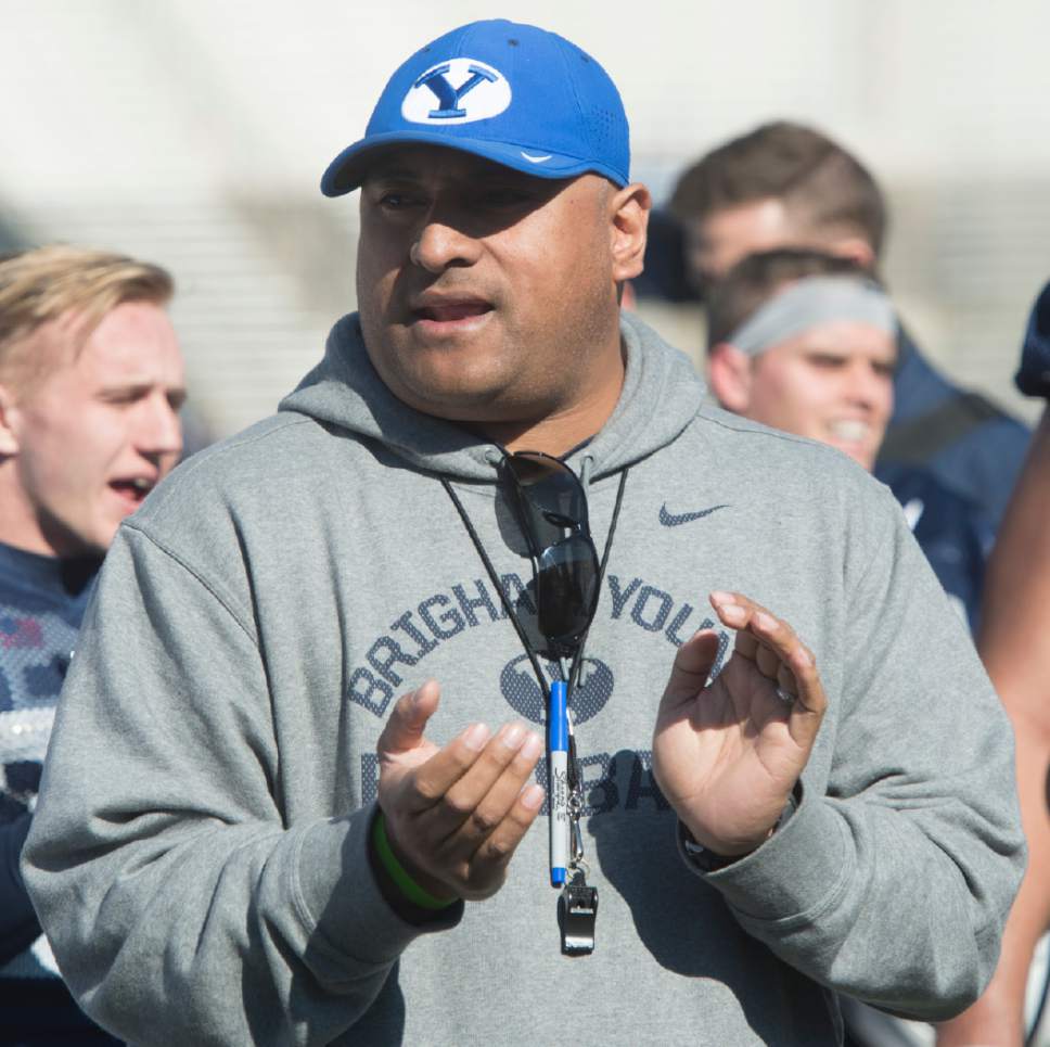 Rick Egan  |  The Salt Lake Tribune

BYU head football coach Kalani Sitake  sings the Cougar fight song, after BYU's final practice of spring camp, at LaVell Edwards Stadium, Friday, April 1, 2016.