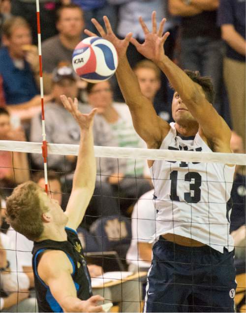 Rick Egan  |  The Salt Lake Tribune

Brigham Young Cougars Ben Patch (13) blocks a hit, in the Mountain Pacific Sports Federation Volleyball Championship, in tournament action at the Smith Field House in Provo, Saturday, April 23, 2016.