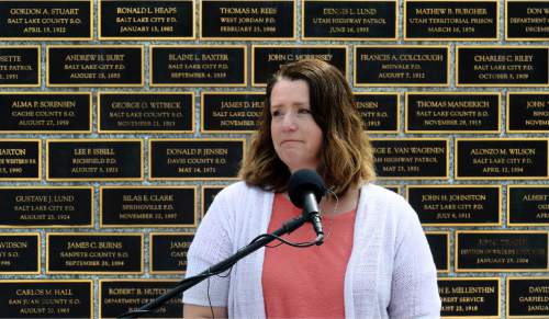 Steve Griffin / The Salt Lake Tribune

Erika Barney talks about her husband Unified Police Officer Douglas S. Barney as the Utah law enforcement community held its annual memorial to police officers killed in the line of duty during the previous year at the State Capitol, Utah Law Enforcement Memorial, West lawn in Salt Lake CityThursday May 5, 2016. Officer Barney was murdered January 17, 2016 while investigating a hit and run crash in Holladay. A second officer, Jon Richey, was wounded but recovered.