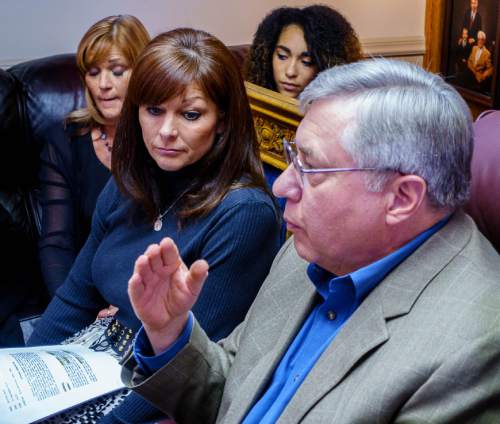 Trent Nelson  |  The Salt Lake Tribune
Attorney Robert Sykes, right, and Darrien Hunt's mother Susan Hunt, center, speak at a press conference in Salt Lake City, Friday October 17, 2014. An autopsy report released Friday says Darrien Hunt was shot several times in the back by Saratoga Springs police officers chasing him. At left is Cindy Moss (Darrien's aunt) and rear, Aliya Hunt (Darrien's sister).