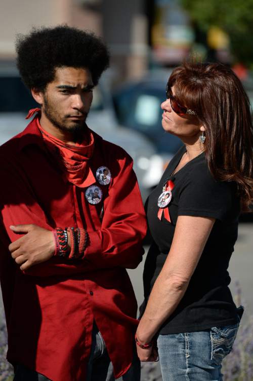 Francisco Kjolseth | The Salt Lake Tribune
Kerahn Hunt, brother of Darrien Hunt who was killed one-year ago at the hands of police, is joined by his mother Susan, outside the Panda Express in Saratoga Springs where Darrien was gunned down on the sidewalk.