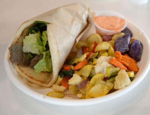 Al Hartmann  |  The Salt Lake Tribune
Hand-held gyro with roasted vegetables, and potato medley and kaftery (spicy) sauce at GR Kitchen, a fast-casual restaurant at 7702 Union Park Ave. in Midvale.