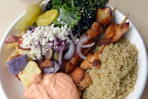 Al Hartmann  |  The Salt Lake Tribune
Chicken souvlaki plate with potato medley, kale salad, quinoa, and kaftery (spicy) sauce at GR Kitchen, a fast-casual restaurant at 7702 Union Park Ave.