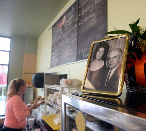Al Hartmann  |  The Salt Lake Tribune
A portrait of Nick and Connie Ligeros rests above the counter at the new Landmark Grill at 760 Fort Union Blvd. in Midvale.  Salt Lake City's legendary Roundhouse breakfast, served at the old Medical Towers restaurant (by owner Nick Ligeros), has returned. Ligeros' daughter, MariAnn Jessee and her husband Mike, recently bought the Landmark Grill and added the Roundhouse to the menu. Jessee said she has been looking to buy a restaurant for about six years so she could resurrect her fathers original recipes and continuing his legacy.