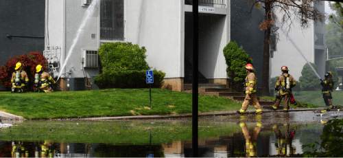 Steve Griffin / The Salt Lake Tribune

Fire fighters spray water on a hot spot of a large apartment fire near 500 east and 4100 south in Salt Lake CityThursday May 5, 2016. Water filled the parking lot as a result of the fire fighting efforts.