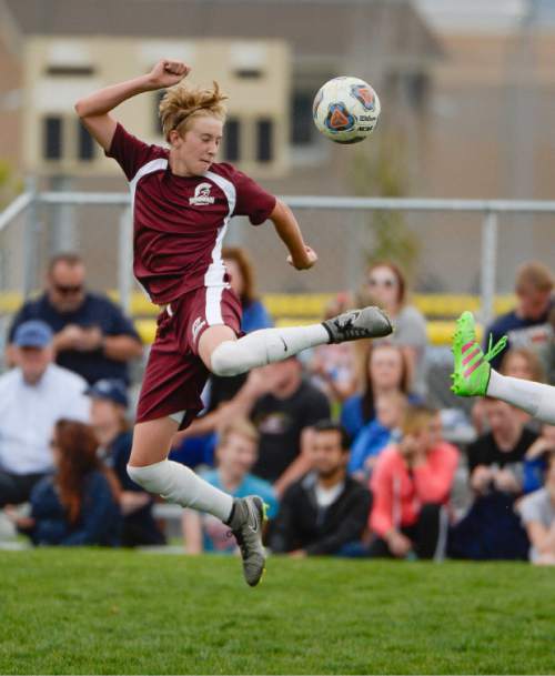Francisco Kjolseth | The Salt Lake Tribune 
Greyson Charlton of Morgan finds himself momentarily airborne before regaining control of the ball against Stansbury in the first round of the boys' soccer Class 3A postseason game on Thursday, May 5, 2016 at Stansbury.