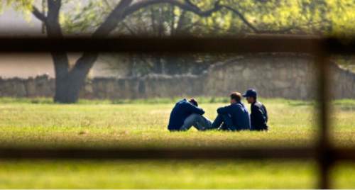 Trent Nelson  |  The Salt Lake Tribune

Three FLDS boys huddle at Fort Concho, where they are being held by Texas Child Protective Services Tuesday, April 8, 2008. CPS says they have taken 401 children from the YFZ Ranch into protective custody and brought them to Fort Concho.