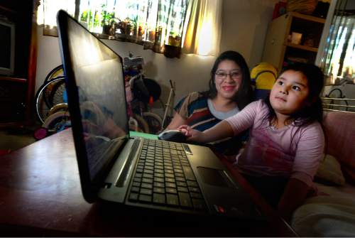 Scott Sommerdorf   |  The Salt Lake Tribune  
Four year old Joselinne Mendez works with her mother, Laura De La Cruz as they use the UPSTART computer software to do preschool at home, Thursday, April 21, 2016.  Lawmakers will meet next month in a special session to consider restoring funding for the UPSTART online preschool program.