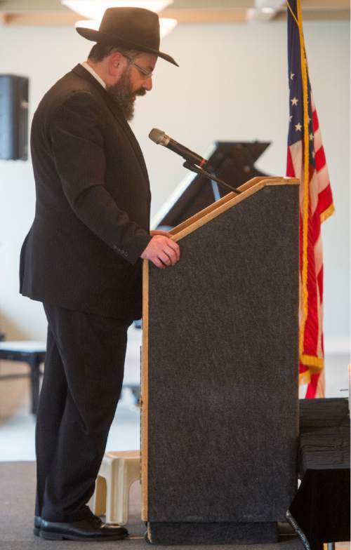 Rick Egan  |  The Salt Lake Tribune

Rabbi Benny Zippel says a prayer at the Utah Holocaust Memorial Commemoration at the Jewish Community Center, Thursday, May 5, 2016.