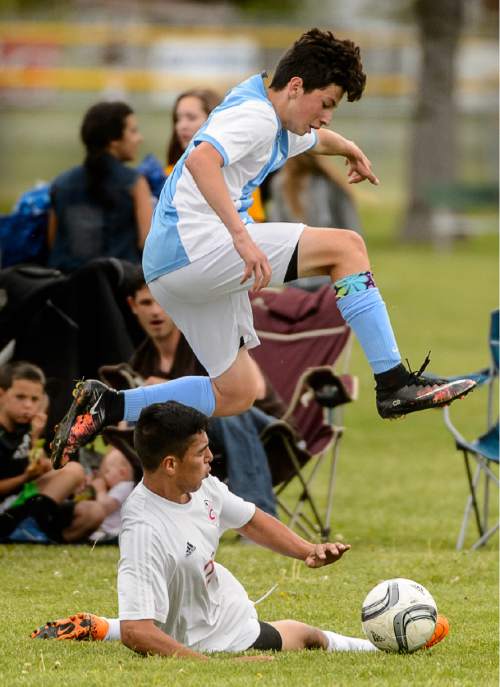 Trent Nelson  |  The Salt Lake Tribune
Ben Lomond's Erik Aroyo leaps over  Grantsville's Branon Tiev in the first round of the boys' high school soccer Class 3A postseason, Thursday May 5, 2016.