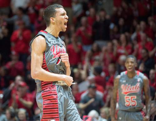Rick Egan  |  The Salt Lake Tribune

Utah Utes forward Brekkott Chapman (0) reacts after bringing the Utes with in two points of the Wildcats with a 3-point shot, in Pac-12 Basketball action at the Huntsman Center, Saturday, February 28, 2015.  Utah Utes guard Delon Wright (55) cheers in the back ground.