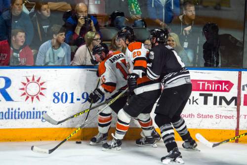 Chris Detrick  |  The Salt Lake Tribune
Komets' Mike Embach (15) Komets' Paul Crowder (20) and Grizzlies' Eric Knodel (6) during Game 4 of the ECHL playoff series at Maverik Center Friday May 6, 2016.