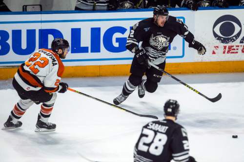Chris Detrick  |  The Salt Lake Tribune
Komets' Jamie Schaafsma (22) and Grizzlies' Marc Cantin (12) during Game 4 of the ECHL playoff series at Maverik Center Friday May 6, 2016.