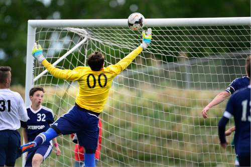 Scott Sommerdorf   |  The Salt Lake Tribune  
Waterford's goalkeeper Michael Woller makes a grab on a shot during first half play. Waterford beat American Leadership Academy, 6-0 in the quarterfinals of the Class 2A boys' soccer tournament, Saturday, May 7, 2016. The game was a rematch of last year's state championship game won by ALA.