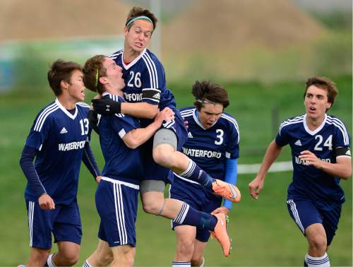 Scott Sommerdorf   |  The Salt Lake Tribune  
Waterford's Daniel Beesley leaps into the arms of Patrick Dowd after Dowd's header found the net for a 1-0 lead. Waterford beat American Leadership Academy, 6-0 in the quarterfinals of the Class 2A boys' soccer tournament, Saturday, May 7, 2016. The game was a rematch of last year's state championship game won by ALA.