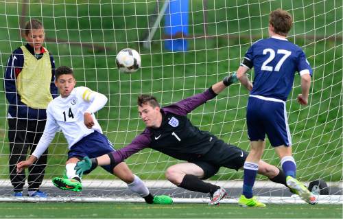 Scott Sommerdorf   |  The Salt Lake Tribune  
American Leadership goalkeeper Taylor Negus managed this save against Waterford's Patrick Dowd during first half play. Waterford beat American Leadership Academy, 6-0 in the quarterfinals of the Class 2A boys' soccer tournament, Saturday, May 7, 2016. The game was a rematch of last year's state championship game won by ALA.
