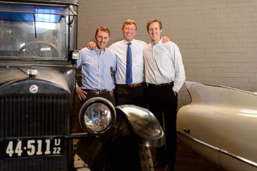 Trent Nelson  |  The Salt Lake Tribune
Auctioneer Rob Olson, right, and his sons Robert, left, and David pose for a photo at Erkelens & Olson, which is celebrating its 40th year in the auction business. Salt Lake City, Friday April 22, 2016. In the photo is a 1922 Studebaker and a 1960 Cadillac.