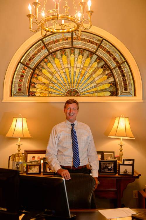Trent Nelson  |  The Salt Lake Tribune
Auctioneer Rob Olson poses for a photo in his office at Erkelens & Olson, which is celebrating its 40th year in the auction business. Salt Lake City, Friday April 22, 2016.