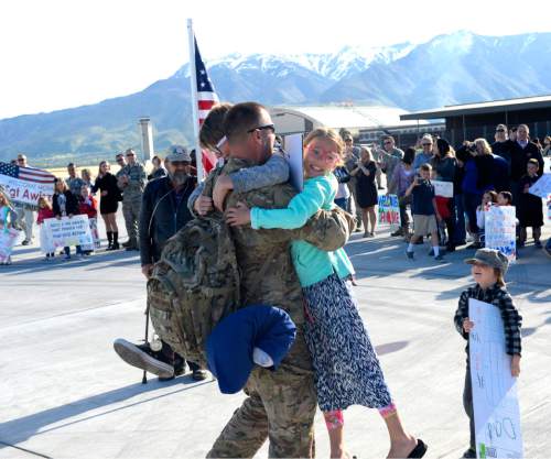 Al Hartmann  |  The Salt Lake Tribune
Airman Sather Hundreds of family members and friends greet members of the 421st Fighter Squadron on May 10, 2016, at Hill Air Force Base. About 300 maintenance and support personnel arrived home after an eight-month assignment in Afghanistan.