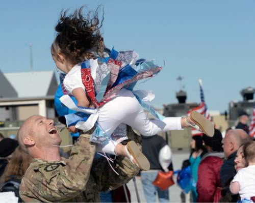 Al Hartmann  |  The Salt Lake Tribune
Tech. Sgt. William Cronin of the 421st F-16 fighter squadron gives his daughter Leah a flying hug Tuesday May 10 at Hill Air Force Base.  Some 300 maintenance and support personnel arrived home after an eight month assignment in Afghanistan.