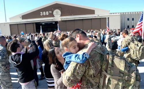 Al Hartmann  |  The Salt Lake Tribune
Hundreds of family members and friends greet members of the 421st Fighter Squadron on May 10, 2016, at Hill Air Force Base. About 300 maintenance and support personnel arrived home after an eight-month assignment in Afghanistan.