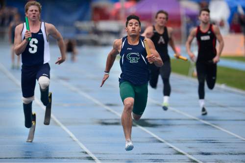 Scott Sommerdorf   |  The Salt Lake Tribune
Karl Kumpin of Copper Hills outsprints Hunter Woodhall of Syracuse, left, to win the Boy's 5A 4x100 meters at the 2015 Utah State High School Track and Field Championships, held at Clarence Robinson stadium at BYU, Saturday, May 16, 2015.