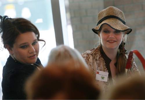 Scott Sommerdorf   |  The Salt Lake Tribune

Tahya, left, and her sister Trishia Felkner enjoy Westminster College's Silver Tea in 2013.