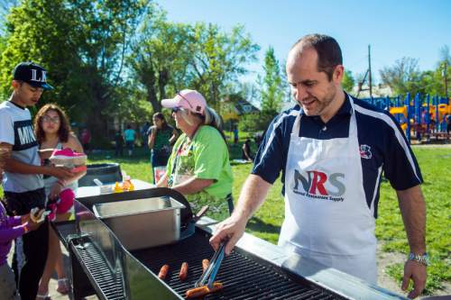 Chris Detrick  |  The Salt Lake Tribune
James Madison Elementary School Principal Vincent Ardizzone grills hot dogs during a school carnival Wednesday May 11, 2016.