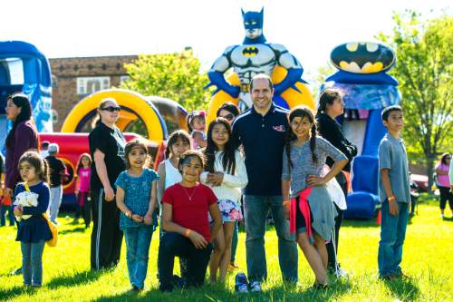 Chris Detrick  |  The Salt Lake Tribune
James Madison Elementary School Principal Vincent Ardizzone poses for a portrait with students during the annual school carnival Wednesday May 11, 2016.