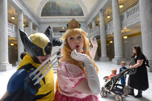 Al Hartmann  |  The Salt Lake Tribune
Cosplayers Wolverine and Princess Peach pose for a photo together at the Utah State Capitol on Wednesday, May 11.  Fans and cosplayers were there for the announcement of Salt Lake Comic Con's celebrity guests for the 2016 edition, set for Sept. 1-3 at the Salt Palace Convention Center.