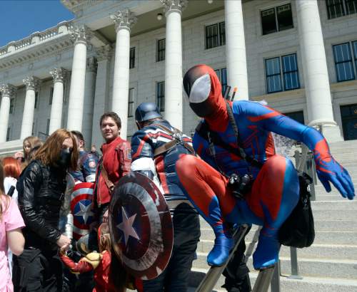 Al Hartmann  |  The Salt Lake Tribune
Cosplayers gather for a group photo on steps at the Utah State Capitol on Wednesday, May 11.  Fans and cosplayers were there for the announcement of Salt Lake Comic Con's celebrity guests for the 2016 edition, set for Sept. 1-3 at the Salt Palace Convention Center.