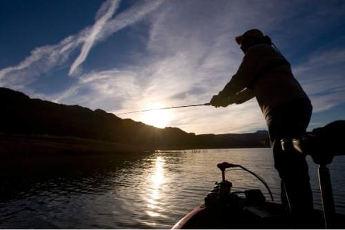 Al Hartmann  |  The Salt Lake Tribune
George Sommer, chairman of the Utah Blue Ribbon Advisory Council, fishes in Lake Powell's Good Hope Bay as the sun sets.