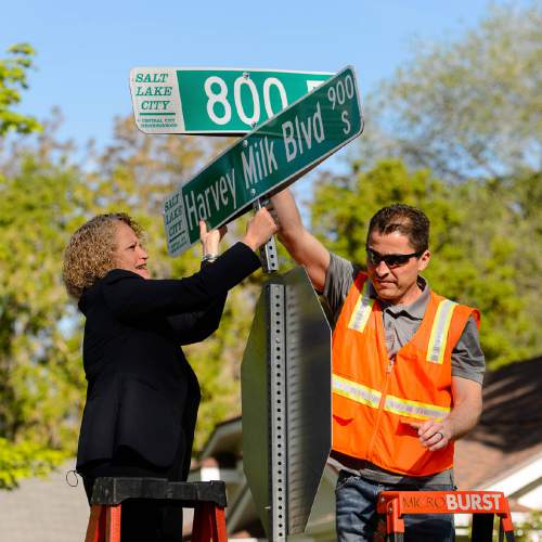 Trent Nelson  |  The Salt Lake Tribune
Mayor Jackie Biskupski and sign shop supervisor James Aguilar hang the first of the Harvey Milk Blvd. street signs along 900 South in Salt Lake City, Friday May 13, 2016. The Salt Lake City Streets Division will hang signs throughout the day between 800 East and 1100 East in preparation for the Harvey Milk Celebration on Saturday, May 14th. Signage along the remaining designated portions of 900 South will be completed in the next few weeks.