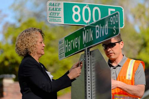 Trent Nelson  |  The Salt Lake Tribune
Mayor Jackie Biskupski and sign shop supervisor James Aguilar hang the first of the Harvey Milk Blvd. street signs along 900 South in Salt Lake City, Friday May 13, 2016. The Salt Lake City Streets Division will hang signs throughout the day between 800 East and 1100 East in preparation for the Harvey Milk Celebration on Saturday, May 14th. Signage along the remaining designated portions of 900 South will be completed in the next few weeks.