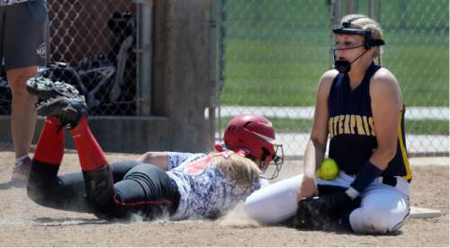 Steve Griffin / The Salt Lake Tribune

Enterprise third baseman Madison Laub blocks a pick off throw from the catcher as Manti's Meg Larson dives back to the third during 2A softball state tournament semifinal game in Spanish Fork, Utah Spanish Fork Friday May 13, 2016.