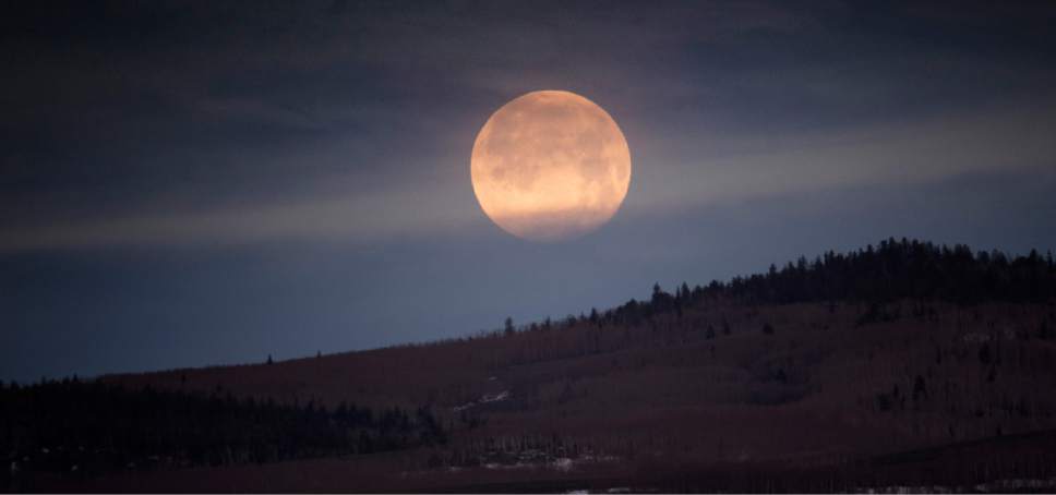 Rick Egan  |  The Salt Lake Tribune

The moon hangs over the Parker Mountains, near Loa, Utah, Friday, April 22, 2016.