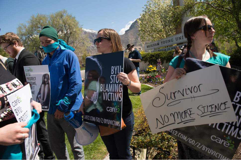 Leah Hogsten  |  The Salt Lake Tribune
Care2 petition signer and sexual assault victim Sarah Belt (right) said BYU needs to remove the culture and fear that keeps sexual assault victims silenced.  Care2 petition supporters delivered 60,000  petition signatures to Brigham Young University's Abraham O. Smoot administration building, Wednesday, April 20, 2016 to protest the school's ÏHonor CodeÓ and to ask the school to add an immunity clause shielding sexual assault victims from Honor Code investigations.