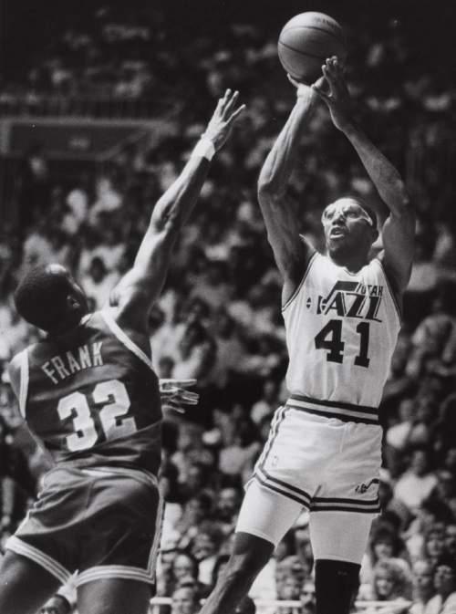 Tribune file photo

Thurl Bailey shoots over Tellis Frank in this 1989 photo.