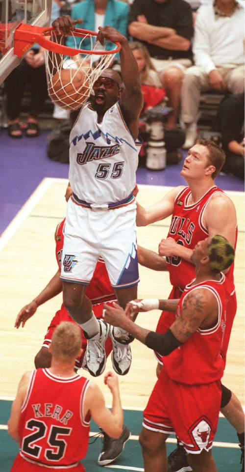 Trent Nelson  |  Tribune File Photo

Antoine Carr dunks against the Chicago Bulls, June 14, 1998.