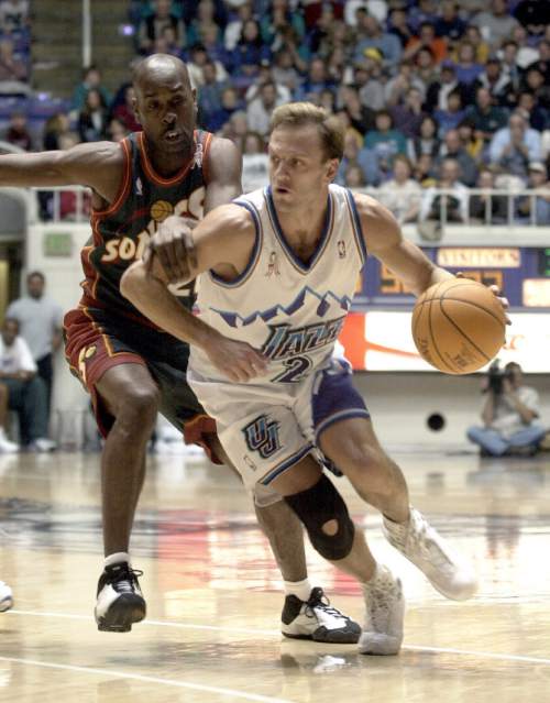 Paul Fraughton  |  Tribune File Photo

Seattle's Gary Payton reaches out and grabs an arm to slow down a fast breaking John Crotty in Thursday's game at Ogden's Dee Events Center.
