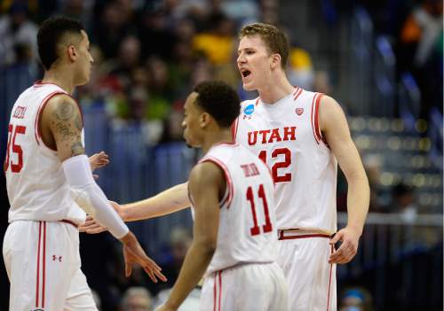 Scott Sommerdorf   |  The Salt Lake Tribune  
Utah Utes forward Jakob Poeltl (42) cheered on his team mates during a second half comeback that took the lead back from Fresno State. Utah beat Fresno State 80-69 in Denver, Thursday, March 17, 2016.