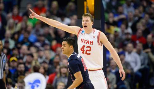 Scott Sommerdorf   |  The Salt Lake Tribune  
Utah Utes forward Jakob Poeltl (42) directs the defense during second half play. Utah beat Fresno State 80-69 in Denver, Thursday, March 17, 2016.