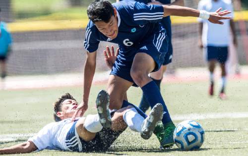 Chris Detrick  |  The Salt Lake Tribune
Juan Diego's Gus Flores (6) jumps over Snow Canyon's Kevin Chillin (32) during the 3A championship game at Alta High School Saturday May 14, 2016.