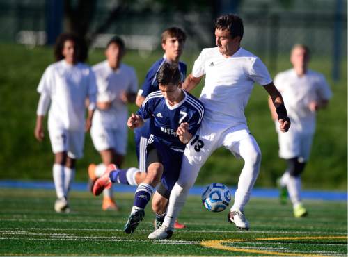 Scott Sommerdorf   |  The Salt Lake Tribune  
Waterford's Alex Aguirre and Manti's Daniel Fruitos battle during first half play. Waterford beat Manti 7-4 in a 2A semi-final at Juan Diego High, Friday, May 13, 2016.