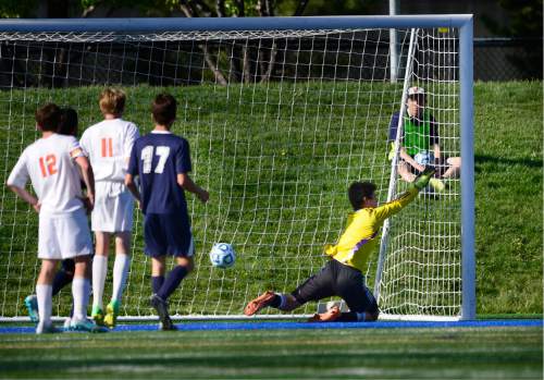 Scott Sommerdorf   |  The Salt Lake Tribune  
Ikkyu Fuji's shot in extra time finds the back of the net past Providence Hall goalkeeper Atticus Pead. Wasatch Academy defeated Providence Hall 3-2 in extra time at Juan Diego High in a 2A semi-final playoff, Friday, May 13, 2016.