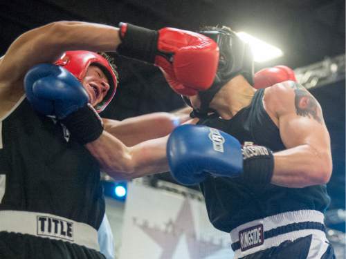 Rick Egan  |  The Salt Lake Tribune

Billy Wagner, Montana (red) fights Danny Galloway, Utah (blue), in the165 weight class, in the Golden Gloves Boxing Rocky Mountain Regionals, at the South Towne Expo Center in Sandy, Saturday, April 30, 2016. Estrada won the match.