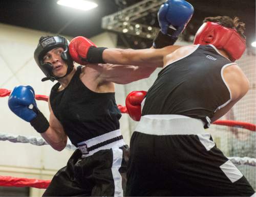 Rick Egan  |  The Salt Lake Tribune

Billy Wagner, Montana (red) fights Danny Galloway, Utah (blue), in the165 weight class, in the Golden Gloves Boxing Rocky Mountain Regionals, at the South Towne Expo Center in Sandy, Saturday, April 30, 2016. Estrada won the match.