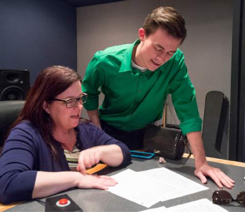 Rick Egan  |  The Salt Lake Tribune

​Carol Anderson, principal coach Utah Opera (left), goes over the music with  Christian Sanders,  before recording vocals for short opera, based on a true story, about a young man who awakens to the news of marriage equality after a suicide attempt.