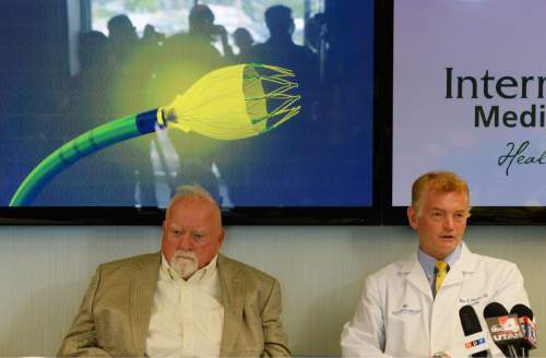 Steve Griffin / The Salt Lake Tribune

Intermountain Medical enter Heart Institute cardiologist Brian Whisenant, MD, right, and patient Wilford Brimley talk about the Watchman left atrial appendage closure device, back, a life-saving and heart-preserving cardiac device that has been tested extensively in clinical trials by scientists and cardiologists at the Intermountain Medical Center Heart Institute in Murray. The device will be available this month, for the first time, to all eligible Utah patients for widespread clinical care outside of the research arena. The device is the first and only one of its kind available in the United States. The Intermountain Medical Center Heart Institute has been one of the leading national research sites, and is the first and only Utah hospital authorized to implant the device at this point. The device was introduced at a press conference at the Intermountain Medical Center Doty Education Center in Murray, Utah Monday May 16, 2016.