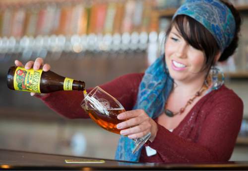 Rick Egan  |  The Salt Lake Tribune

Emily Fuchs pours a beer at Uinta Brewing Co.. American Craft Beer Week is May 16-22.